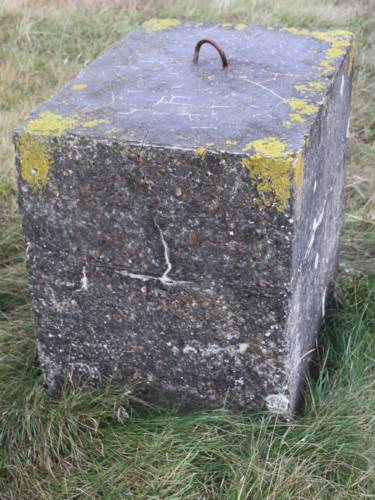 Guy rope concrete block by unknown purpose building ND 2048 7659